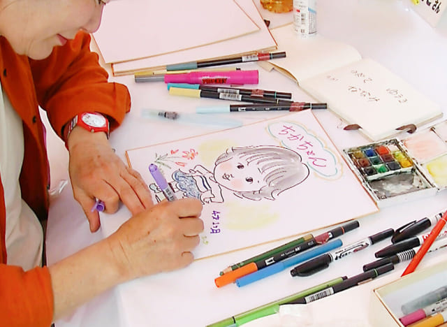 似顔絵体験の様子